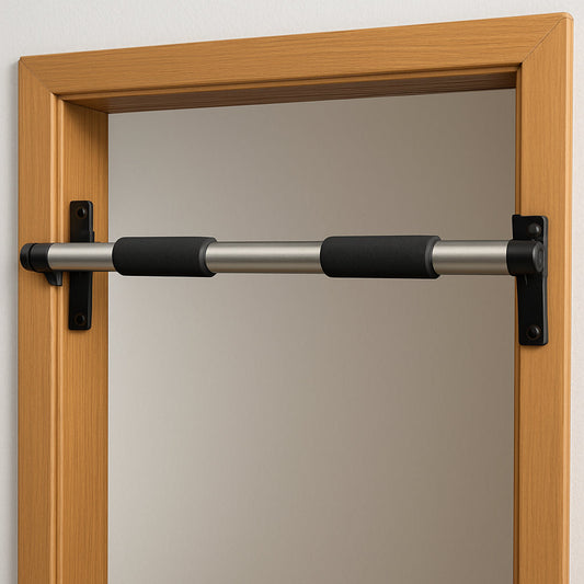 A sleek steel doorway pull‑up bar mounted on a wooden doorframe, showing both knurled steel and padded rubber grips. Alt: Doorway pull‑up bar for portable strength training