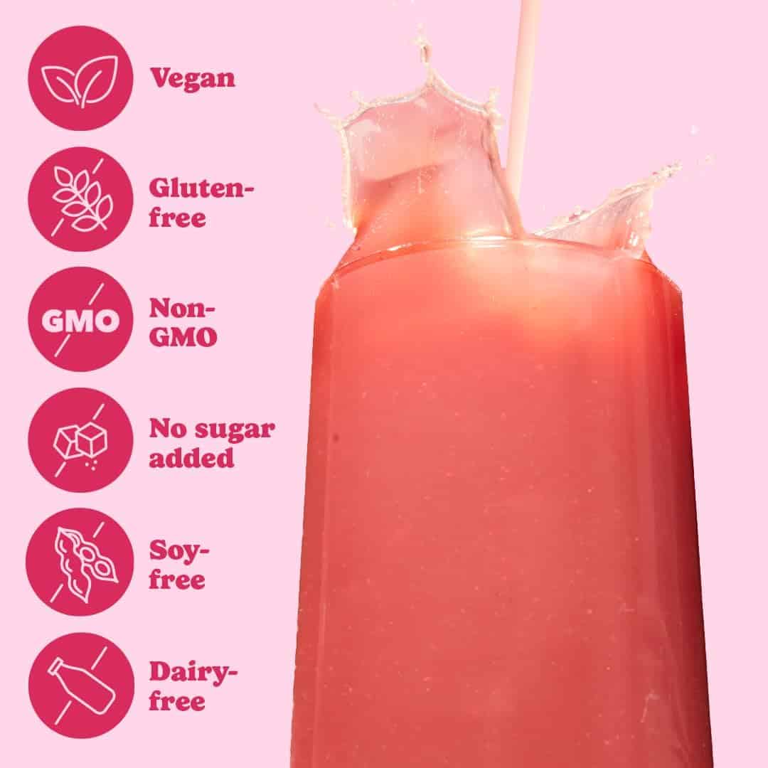 Red smoothie being poured with health benefits icons on a pink background