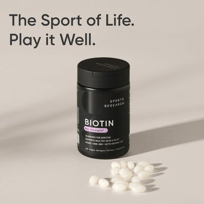 Biotin supplement container with scattered capsules on a neutral background, featuring the text 'The Sport of Life. Play it Well.