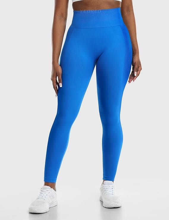 Person wearing bright blue leggings on a white background