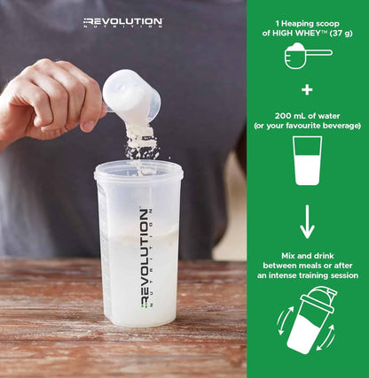 Person pouring a scoop of protein powder into a container with Revolution Nutrition branding.
