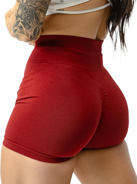 Red high-waisted shorts worn by a person on a white background