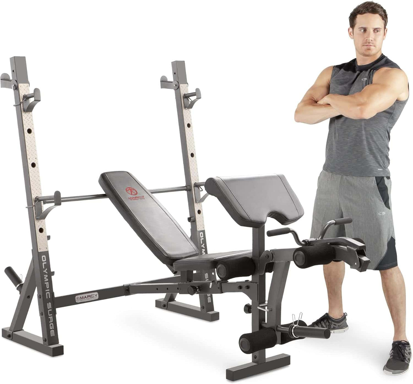 Man standing next to a weight bench and weight rack on a white background