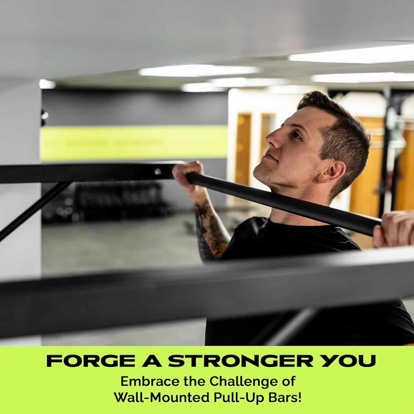 Person using a wall-mounted pull-up bar in a gym setting with motivational text.