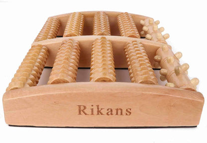 Wooden massage tool with textured surface and 'Rikans' branding on a white background