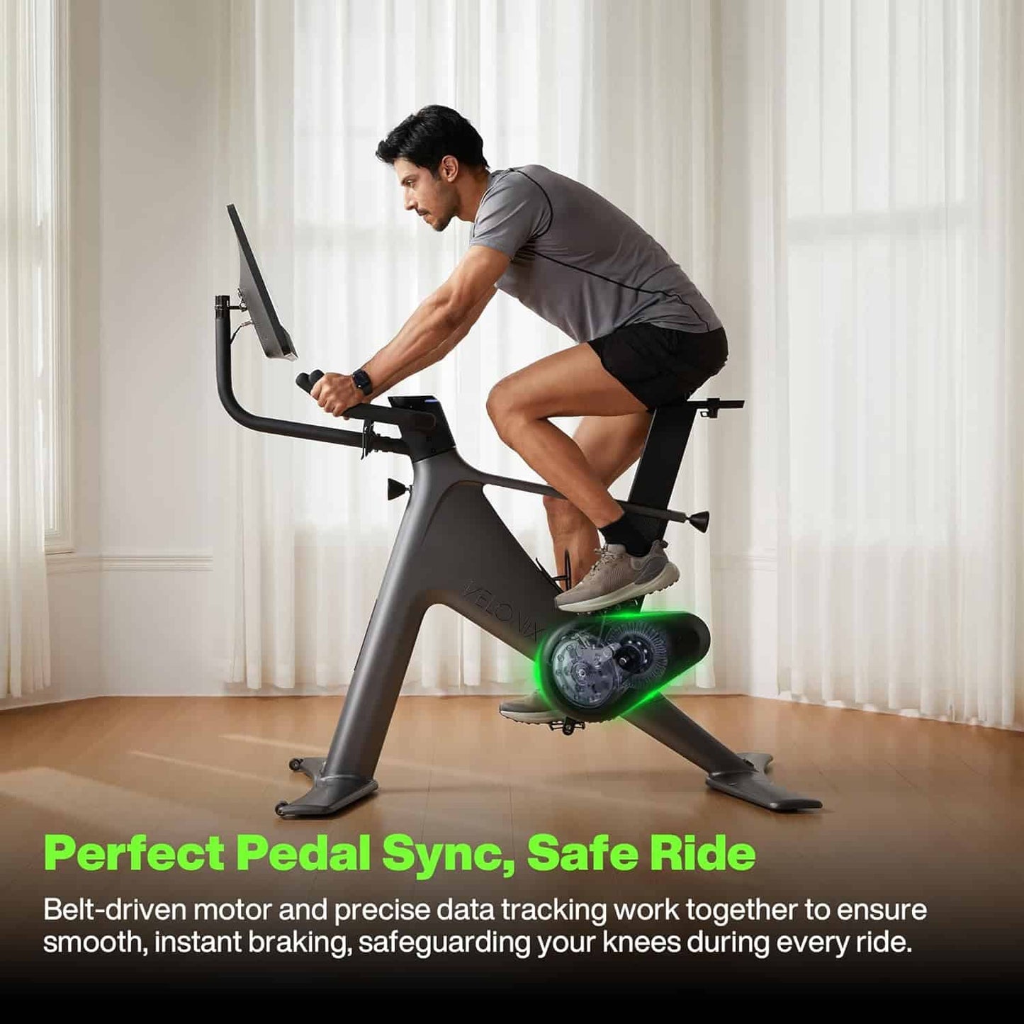 Person using a stationary bike with text about pedal sync and safety